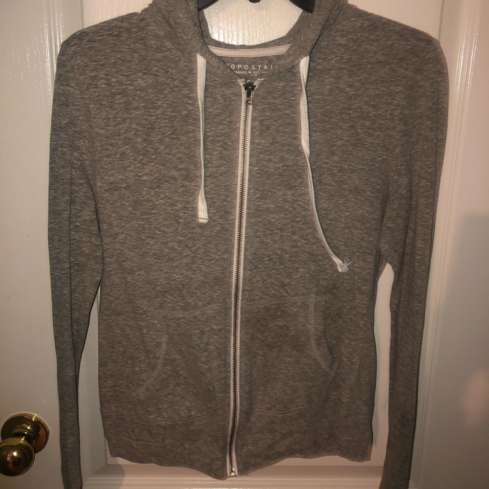gray zip up jacket